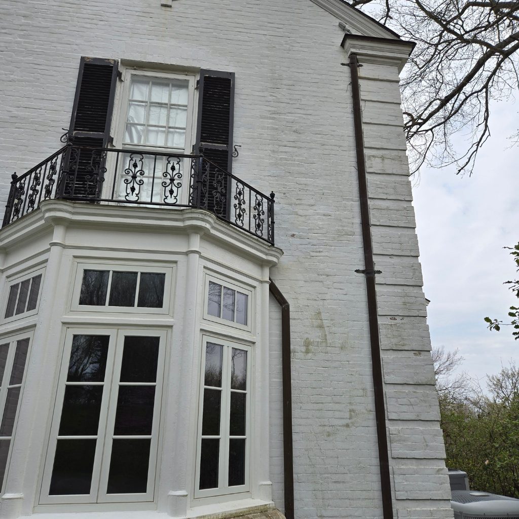 Before — Painted brick colonial, organic staining removed by Shine in Cincinnati