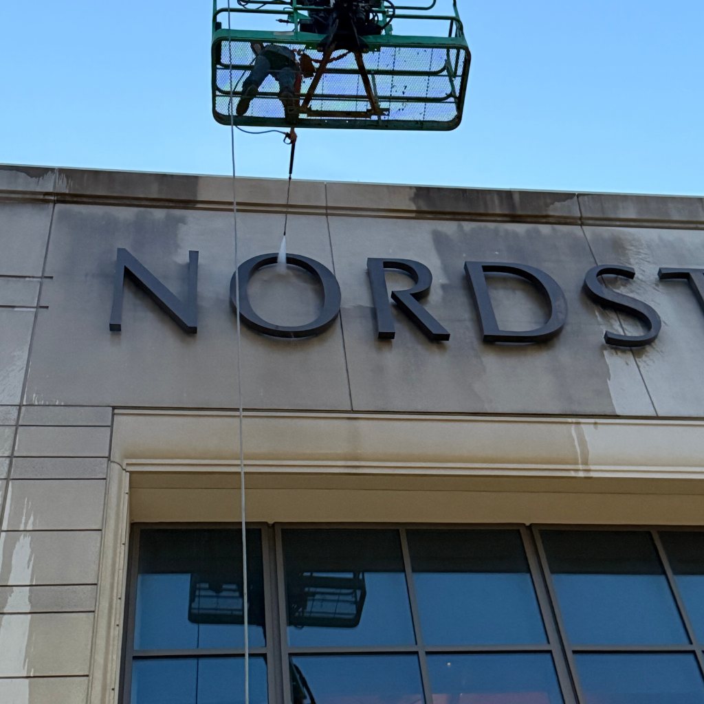 Before — Building washing — limestone facade at a retail anchor