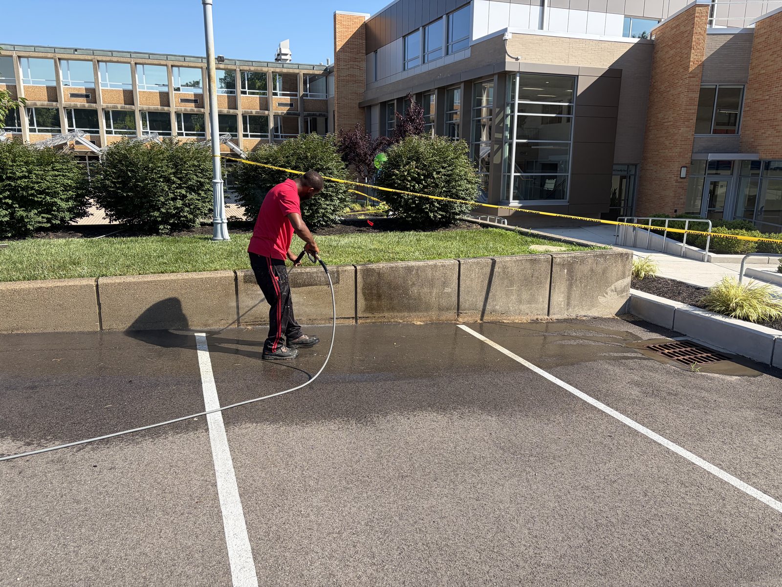 Cleaning a parking area and curb line at a commercial property — flat surface pressure washing by Shine