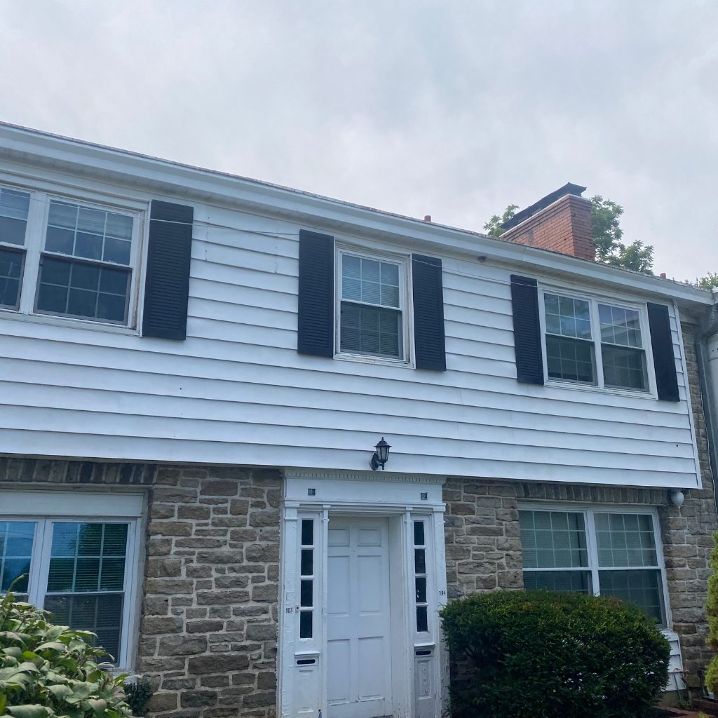 After — White clapboard and stone, algae and staining removed by Shine in Cincinnati
