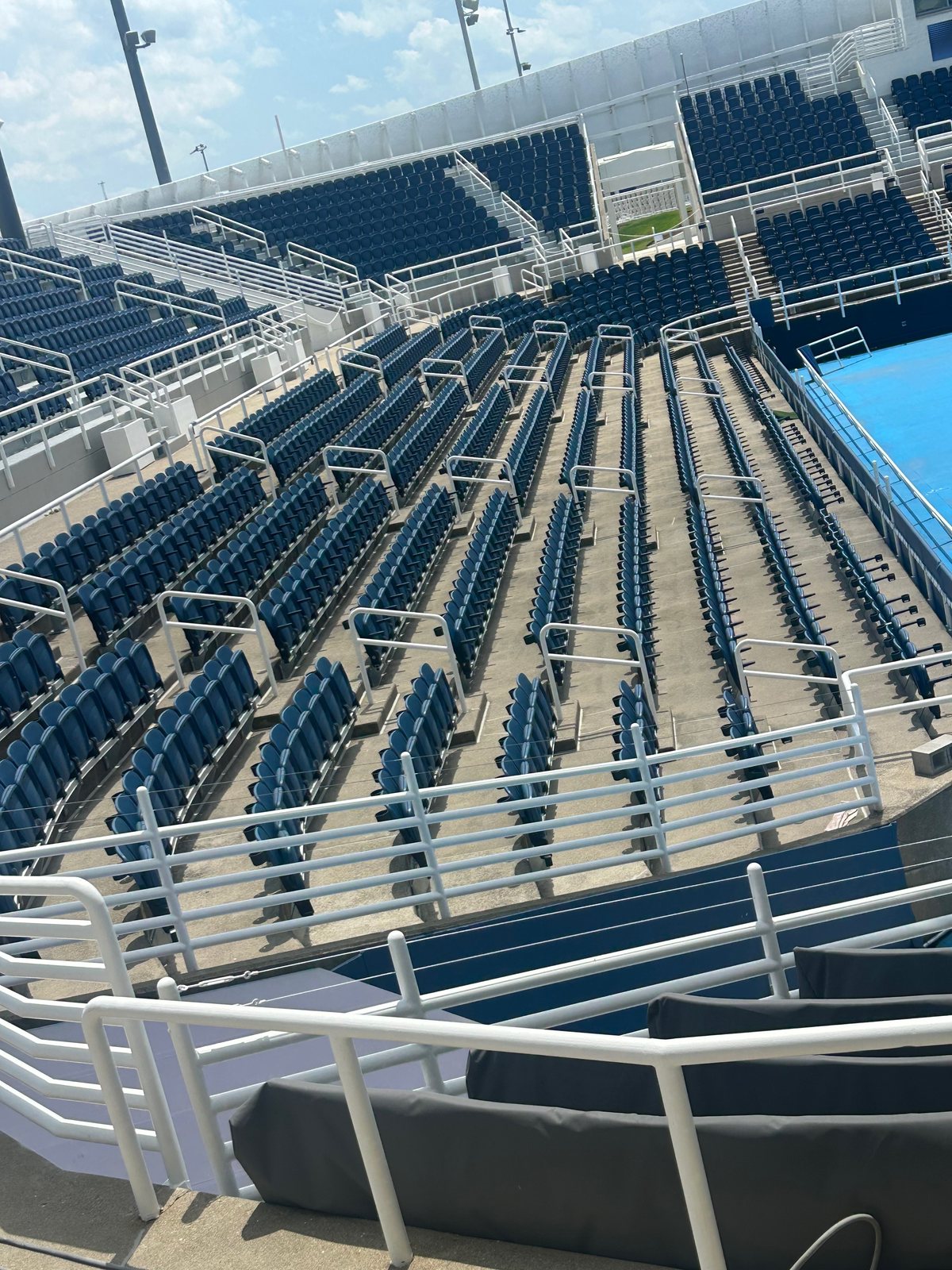 Before — Seating bowl treads and aisles at a large event venue, flat surface pressure washing by Shine