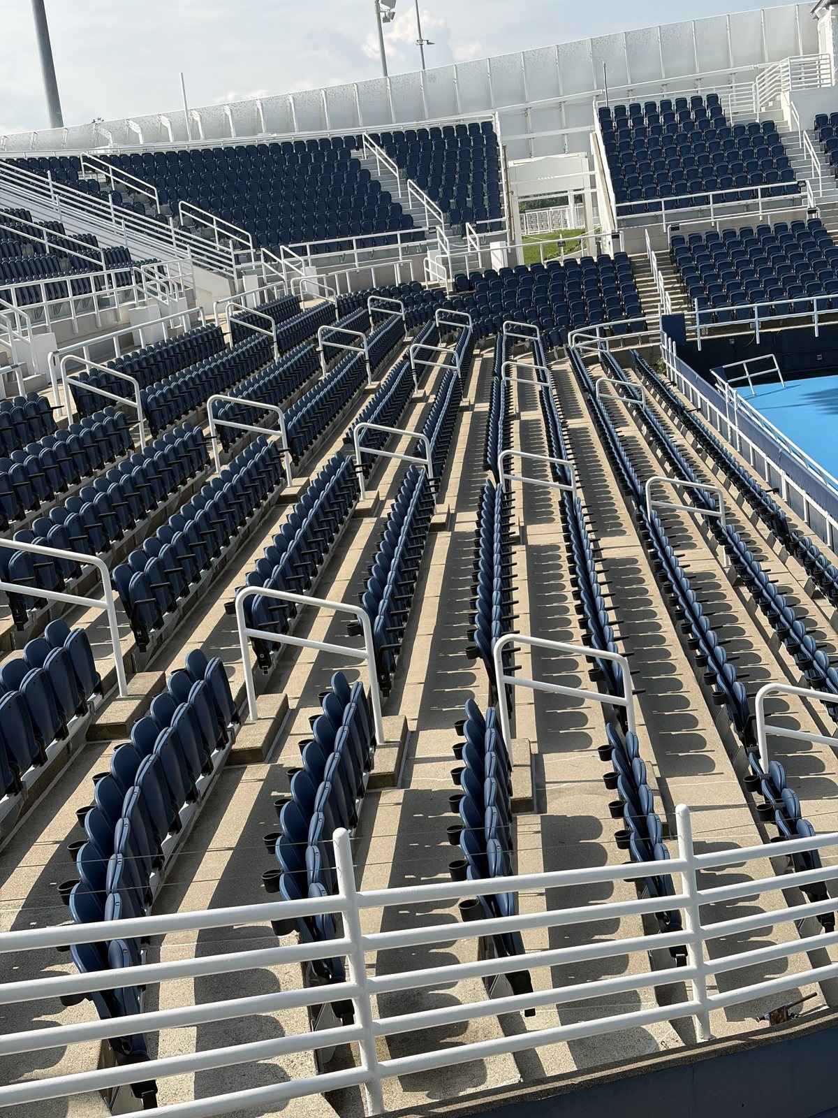After — Seating bowl treads and aisles at a large event venue, flat surface pressure washing by Shine