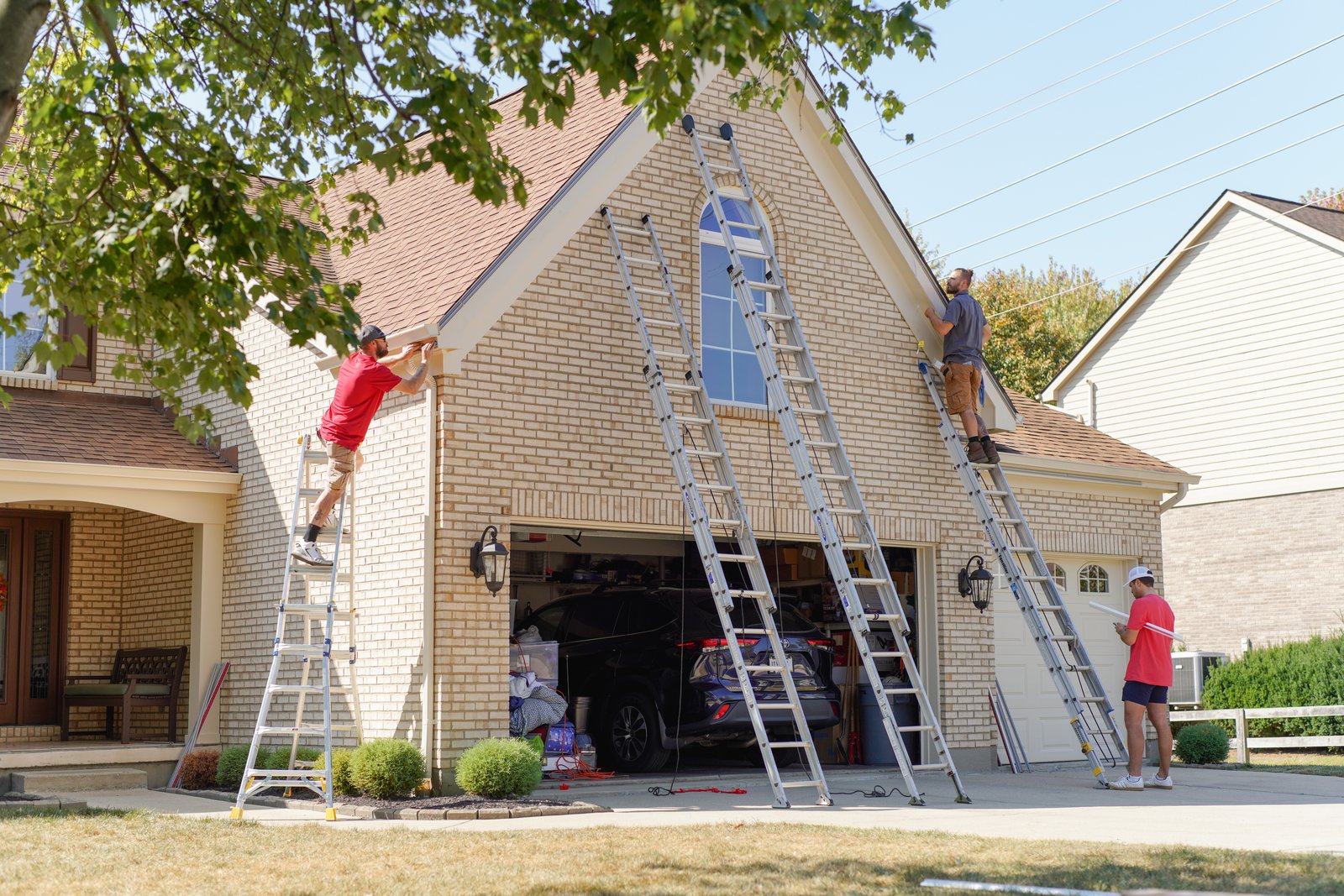 Shine technicians installing OmniRGB track on a Cincinnati home (1 of 2)